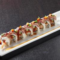 Surf & Turf Roll · Shrimp and asparagus tempura rolled and topped with seared filet mignon; finished with green...