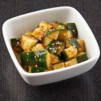 Spicy Cucumber Salad · Diced cucumber tossed in spicy kimchi sauce; topped with sesame seeds and togorashi.