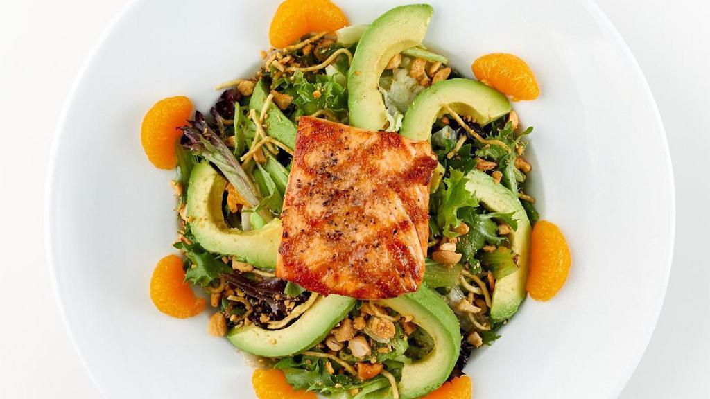 Nutty Grilled Salmon Salad · Grilled Salmon tossed with cashews, edamame, carrots and mixed greens in Japanese vinaigrette, topped with avocado, mandarin oranges and fried noodles. FOR EVERY PURCHASE OF THIS ITEM,. $2 WILL BE DONATED TO ST. JUDE.