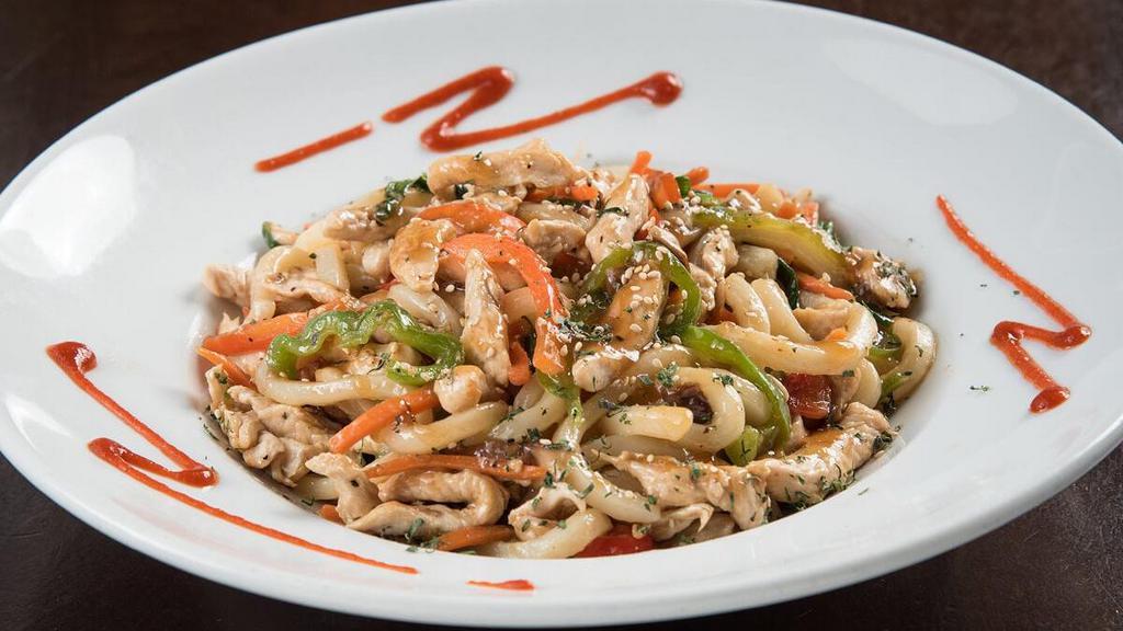 Spicy Chicken Teriyaki Udon · Stir-fried Asian vegetables tossed with chicken and udon noodles in spicy teriyaki sauce