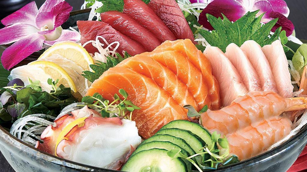 Sashimi Assortment* · Four slices of each: tuna, salmon and yellowtail; three slices of whitefish, two pieces of red shrimp, two slices of octopus; served with a bowl of rice.