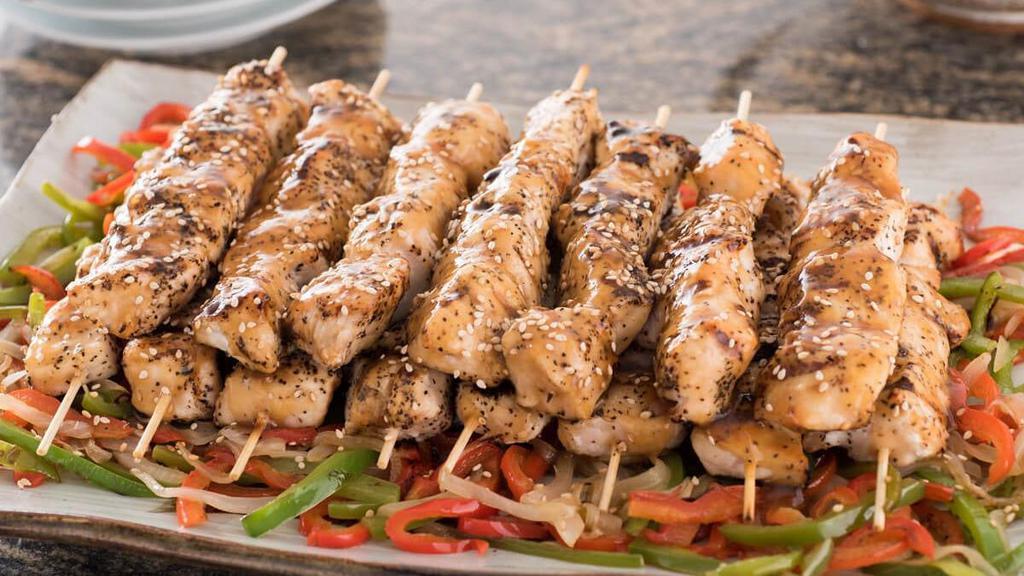 Chicken Yakitori · Skewers of grilled chicken in sake teriyaki sauce; served with sautéed onions and bell peppers