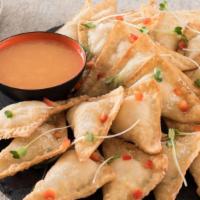 Pineapple Cheese Wontons · Pineapple and cream cheese get a scallion punch, in a sweet and creamy filled crispy wonton;...
