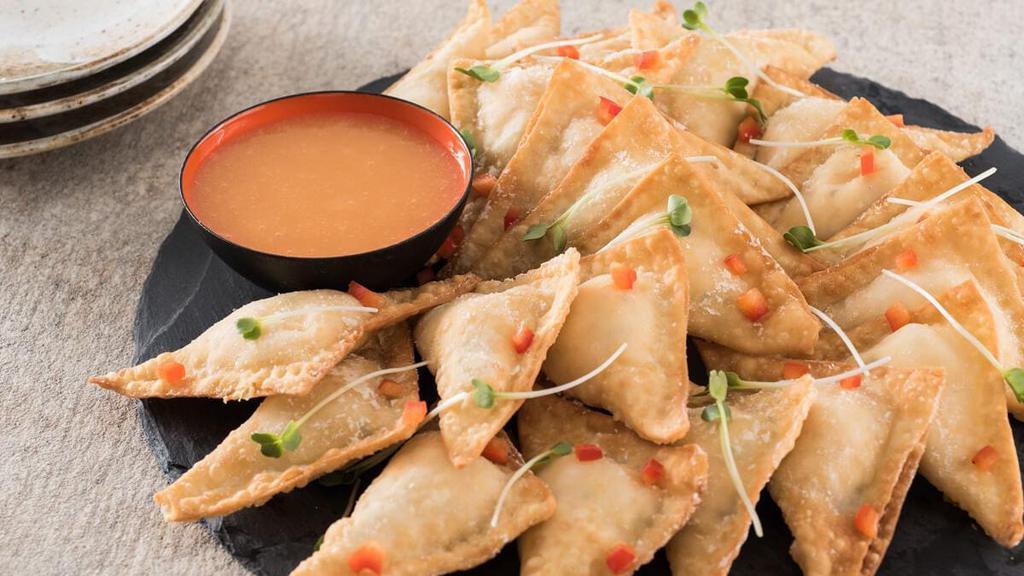 Pineapple Cheese Wontons · Pineapple and cream cheese get a scallion punch, in a sweet and creamy filled crispy wonton; served with pineapple dipping sauce