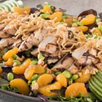 Nutty Grilled Chicken Salad · Grilled chicken tossed with cashews, edamame, carrots and mixed greens in Japanese vinaigret...