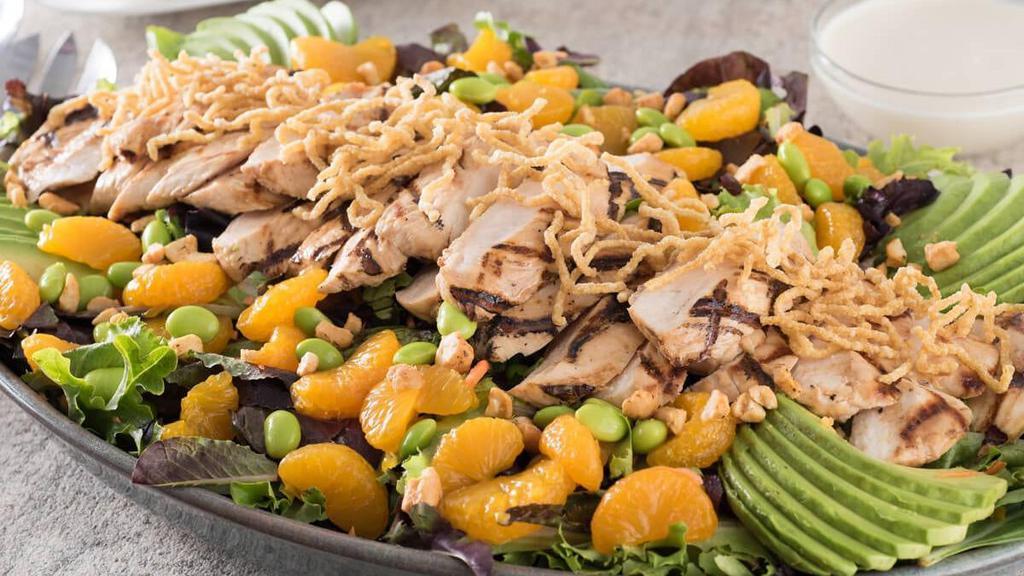 Nutty Grilled Chicken Salad · Grilled chicken tossed with cashews, edamame, carrots and mixed greens in Japanese vinaigrette, topped with avocado, mandarin oranges and fried ramen noodles