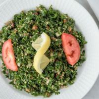 Tabbouleh · Mixed parsley. Chopped Tomatoes and onions with our spices and oils.