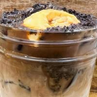 Oreo Master Flan Macchiato (Iced) · Oreo and coffee makes a tasty coffee break!  Topped with Oreo crumbles and a slice of flan t...