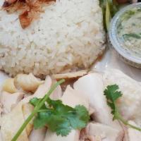 Hainan Chicken (White Meat Only) · Hainan chicken (breast meat) served with garlic rice, fried shallots, pickled cucumbers, gin...