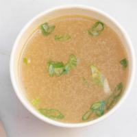 Chicken Bone Broth · Chicken bone broth that has been cooked for 24 hours. Topped with scallions.