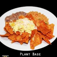 Plant Base Chilaquiles · Tortilla chips tossed with sauce of your choice, plant base cheese, and topped with mung bea...