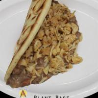 Plant Base Baleada · Flour Tortilla with refried beans, plant base cheese, and sour cream. With an additional cos...