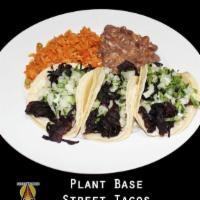 Plant Base Taco Plate · Corn tortilla with protein of your choice, onion, cilantro. Served with rice and beans.