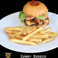 Sunny Burger · Brioche bread with beef patty, tomato, grilled onion, lettuce, cheddar cheese and mayo. Serv...