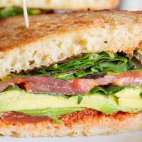Vegan Delight Sandwich · Loads of avocado, heirloom tomato, cucumber, mixed greens, basil, bruschetta, olive oil.