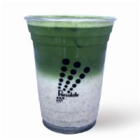 Spotted Matcha · A layered matcha latte with roasted black sesame served over ice.