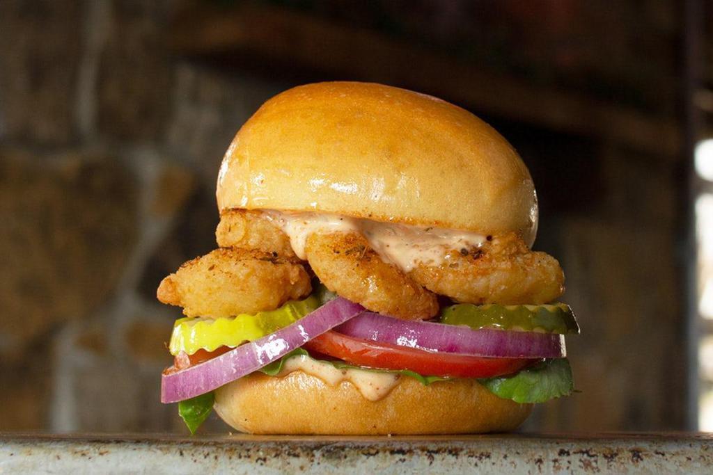 Fried Popcorn Shrimp Roadies · Coastal blues that will make your mouth happy - remoulade, pickles, tomatoes, red onions and lettuce.