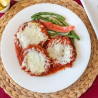 Eggplant Parmigiana · Served with side of pasta with marinara sauce & 
side of vegetables.