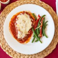 Chicken Parmigiana · 2 Boneless chicken breaded and fried, then baked in our special sauce and mozzarella cheese,...