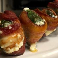 Jalapeno Poppers · Jalapeno stuffed with cream cheese and wrapped in bacon, skewered and fried.