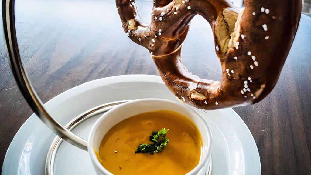 Giant Pretzel With Pub Cheese · Giant Bavarian Style Pretzel served with our pub cheese sauce.