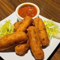 Fried Mozzarella Cheese Sticks · Mozzarella stick battered and fried with your choice of sauce