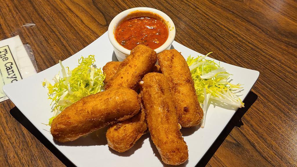 Fried Mozzarella Cheese Sticks · Mozzarella stick battered and fried with your choice of sauce