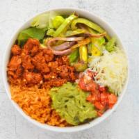 Chicken Al Carbon Burrito Bowl · Chicken thigh meat, spanish rice, black beans, pico de gallo, and shredded cheese over romai...