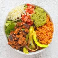Baja Fish Burrito Bowl · Fried fish, Spanish rice, pinto beans, pico de gallo, and shredded cheese over lettuce.