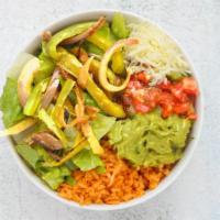Vegetarian Burrito Bowl · Fajita onions and peppers, guacamole, Spanish rice, pinto beans, pico de gallo, and shredded...