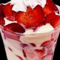 Frescas Con Crema · Finely chopped strawberries served in a cup with sweet cream, granola and topped with whippe...