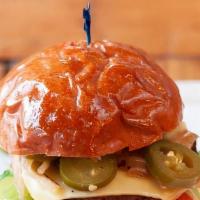 Beyond Vegan Burger · Beyond vegan patty, arugula, grilled onion, tomato, pickles, jalapeño, vegan cheese.