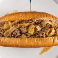 Cheesesteak · Thinly sliced sirloin beef, grilled onions, cheese sauce, French roll.
