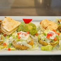 Xoc Platter · Two crispy taquitos (chicken and potato), quesadillas, sopes, and fresh guacamole.