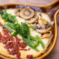 Queso Fundido · Melted oaxaca cheese served with your choice of chorizo, mushroom or rajas (Chile poblano). ...