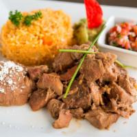 Carnitas Platter · Pork loin slowly cooked in its own juices with beer, soda, and spices. Served with rice, ref...