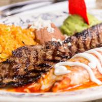 Arrachera Steak · Tender marinated char-broiled skirt steak. Served with a chicken enchilada tapatia, guacamol...