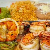 Fajitas De Camaron · Large prawns grilled with sautéed tomatoes, green bell peppers, and onions. Served with rice...