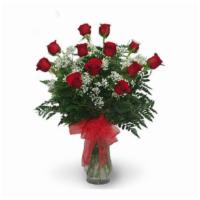 Dozen Red Roses · 12 imported fresh red roses arranged in a clear vase with green and filler, with nice bow in...