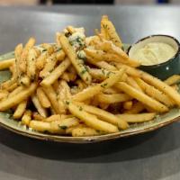 Classic Truffle Fries · French fries tossed with parmesan, parsley, truffle oil, and smoked salt.