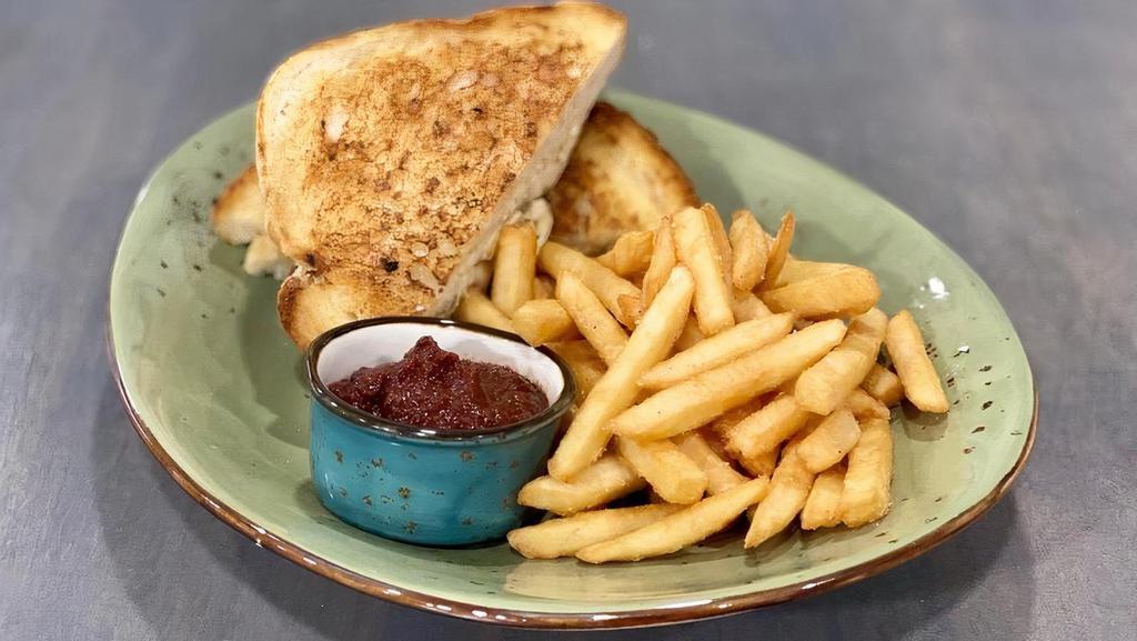 Ultimate Grilled Cheese With Fries · Griddled parmesan sourdough bread with house cheddar, pimento, and fresh mozzarella. Served with fries.