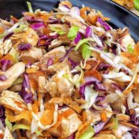 The Koop Crispy Salad · Mix green and red cabbage salad, wonton strips, roasted almonds, Shredded roasted chicken an...