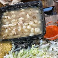 Large Chicken Pozole Soup · Fresh Chicken Broth with hominy with a side of cabbage, radishes, onions, oregano,limes & Ch...