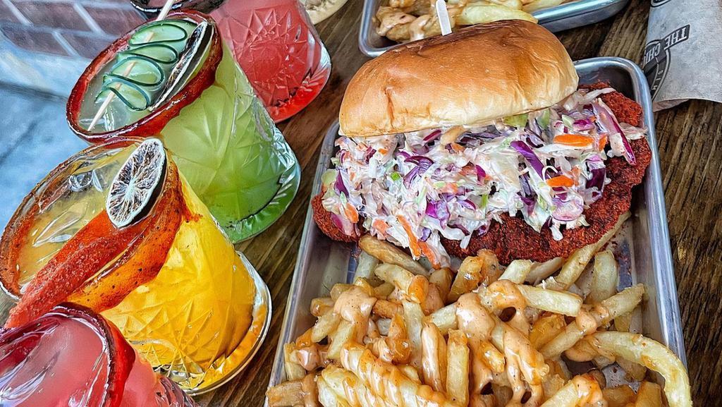 Fried Chicken Sandwich · Marinated chicken breast, coleslaw, chipotle, pickles on Hawaiian bun and side of garlic fries.