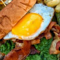 Breakfast Sandwich  · Sunny side up egg topped with Lettuce, tomatoes, bacon, mozzarella cheese, & chipotle on Haw...
