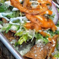 Chicken Taquitos (5) · 5 rolled up fried chicken Taquitos topped with lettuce, cotija cheese, sour cream & purple o...