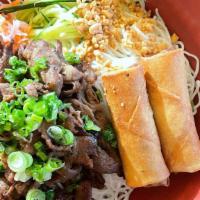 Bun Cha Gio Thit Nuong · Rice vermicelli with char-broiled beef or pork, egg rolls, and vegetables.