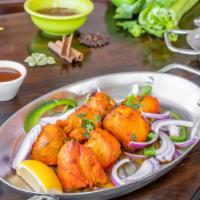 Chicken Tikka · Boneless chicken breast Marinated in yogurt, rare spices, fresh lime juice & saffron, barbec...