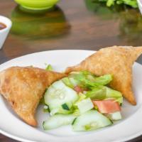 Chicken Samosa (2 Pcs) · Ground chicken and spices wrapped in a homemade flour pastry dough and deep-fried.