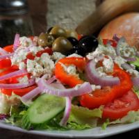 Greek Salad · Lettuce, cucumber, tomatoes, onions, olives, red bell pepper and feta cheese with greek dres...